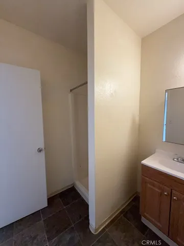 a view of storage and utility room with washer and dryer