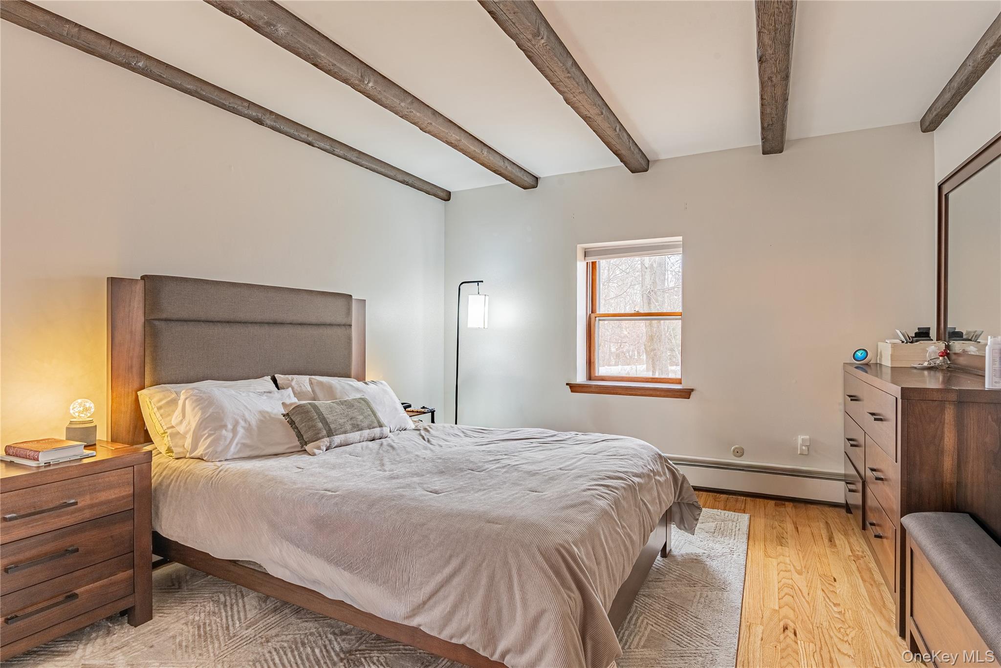 23 Musselman Drive Poughkeepsie, NY 12601 - Photo 23 of 34 Bedroom featuring baseboard heating, light wood-style flooring, and beam ceiling