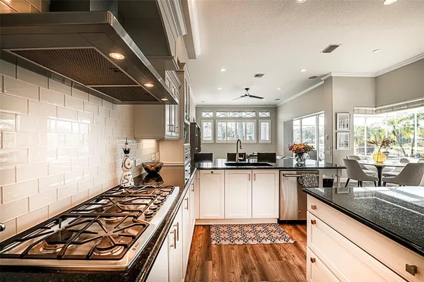 a view of a dining room with furniture and a window