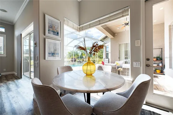 a spacious bedroom with a bed and a chandelier