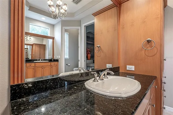 a utility room with cabinets washer and dryer