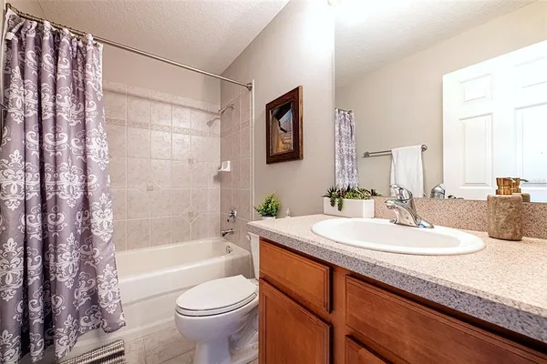 a vase of flowers sitting on a table