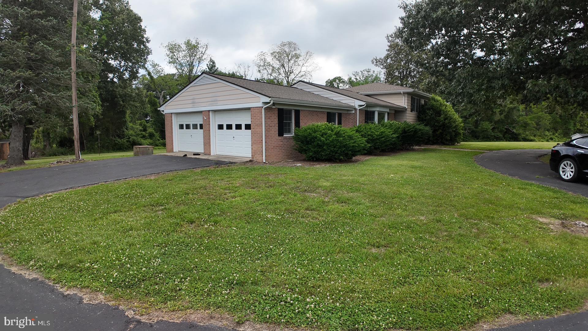 8936 Goldsborough Neck Road Easton, MD 21601 - Photo 5 of 13 a view of house with garden and trees