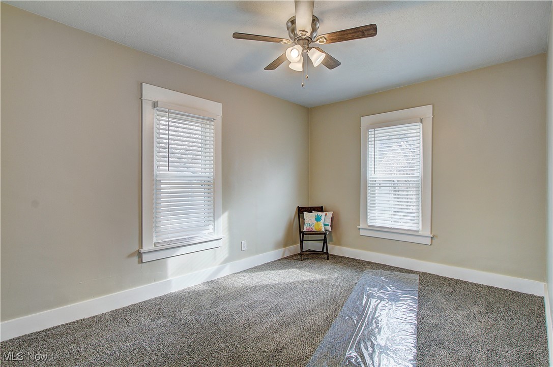 3018 2nd Street Northwest Canton, OH 44708 - Photo 29 of 42 Bedroom 3 with new carpet and ceiling fan.