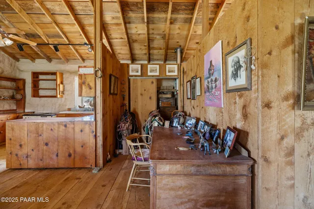 a room with lot of furniture and a chandelier