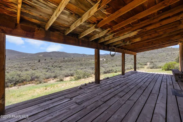 a view of mountain with wooden floor