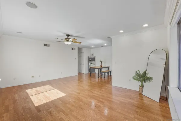 a view of dining room with furniture and wooden floor