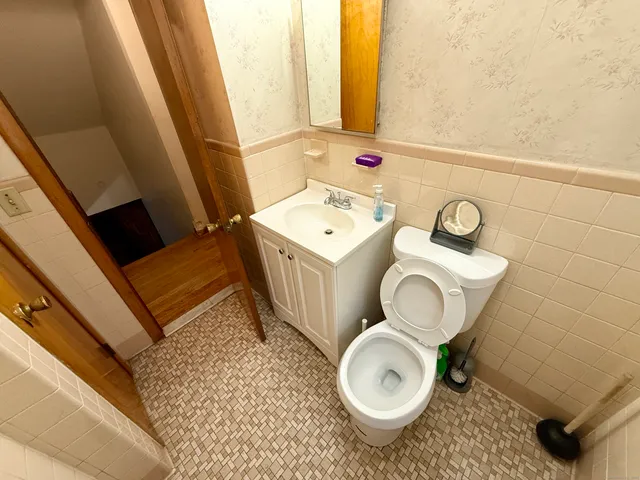 a room with water heater and utility racks