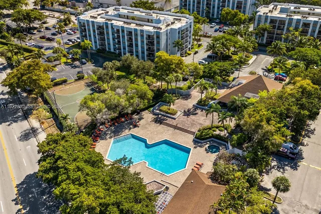 an aerial view of a house with a yard and garden