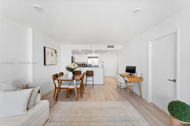 a dining room with a table and chairs