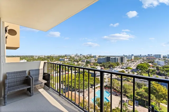 a view of a city skyline from a balcony