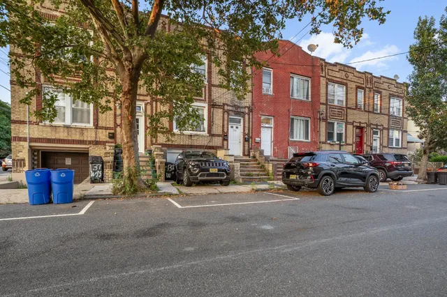 a view of a cars parked in front of a building