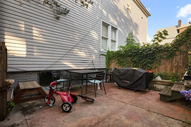 a view of backyard with small cabin and a couch