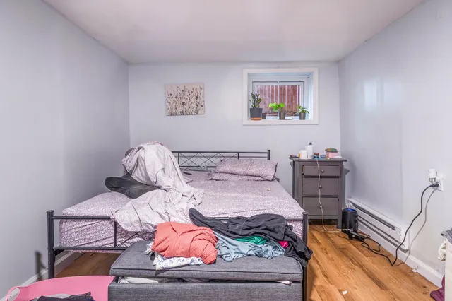 a bedroom with a bed and furniture