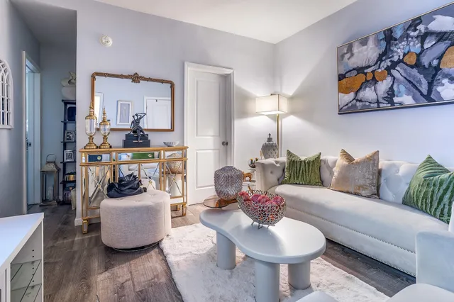 a living room with furniture and a lamp