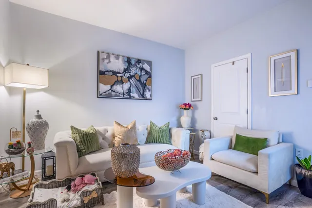 a living room with furniture and a table