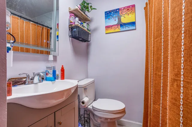a bathroom with a sink and a toilet
