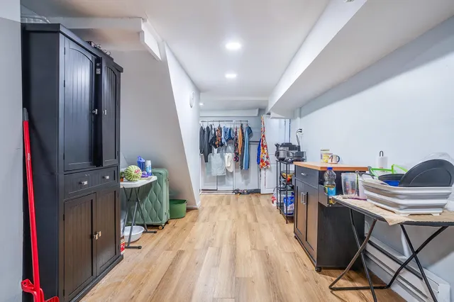 a view of a hallway with seating space