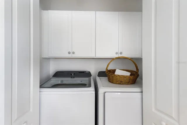 a view of a dining room with furniture wooden floor and chandelier