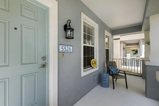 a view of a room that has a bench and a window
