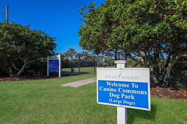 a view of a balcony with wooden floor and fence