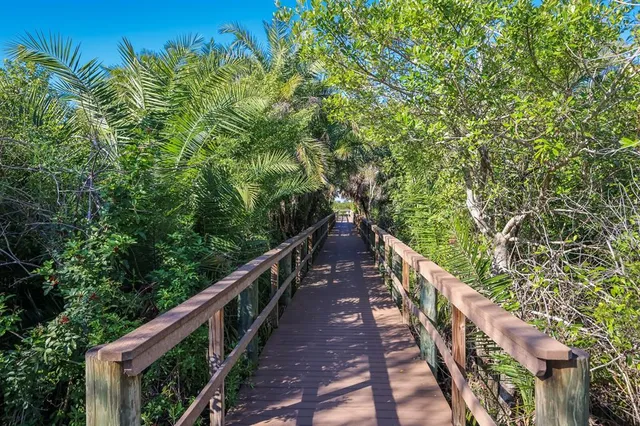 a view of a lake with houses in the back