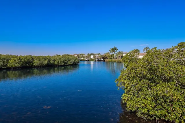 a view of a dinning room with balcony and wooden fence