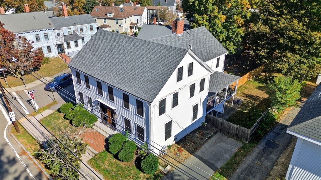 12 Salem Street, Unit 2 Haverhill, MA 01835 - Photo 1 of 34 an aerial view of multiple houses with yard