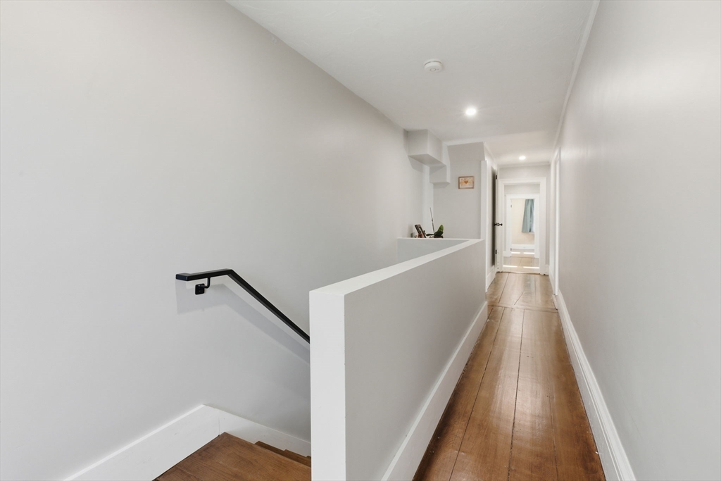 12 Salem Street, Unit 2 Haverhill, MA 01835 - Photo 16 of 34 a view of a hallway with wooden floor
