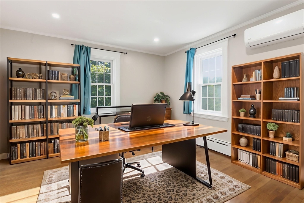 12 Salem Street, Unit 2 Haverhill, MA 01835 - Photo 23 of 34 a view of a workspace with furniture and a bookshelf