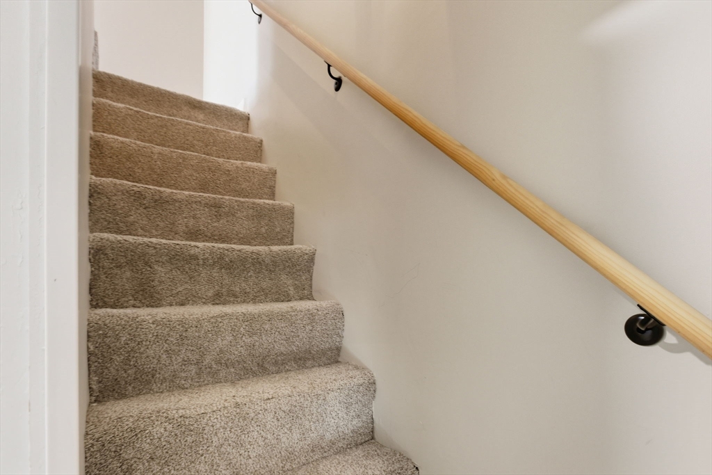 12 Salem Street, Unit 2 Haverhill, MA 01835 - Photo 25 of 34 a view of staircase with white walls and white door