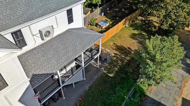 an aerial view of a house stairs and a yard