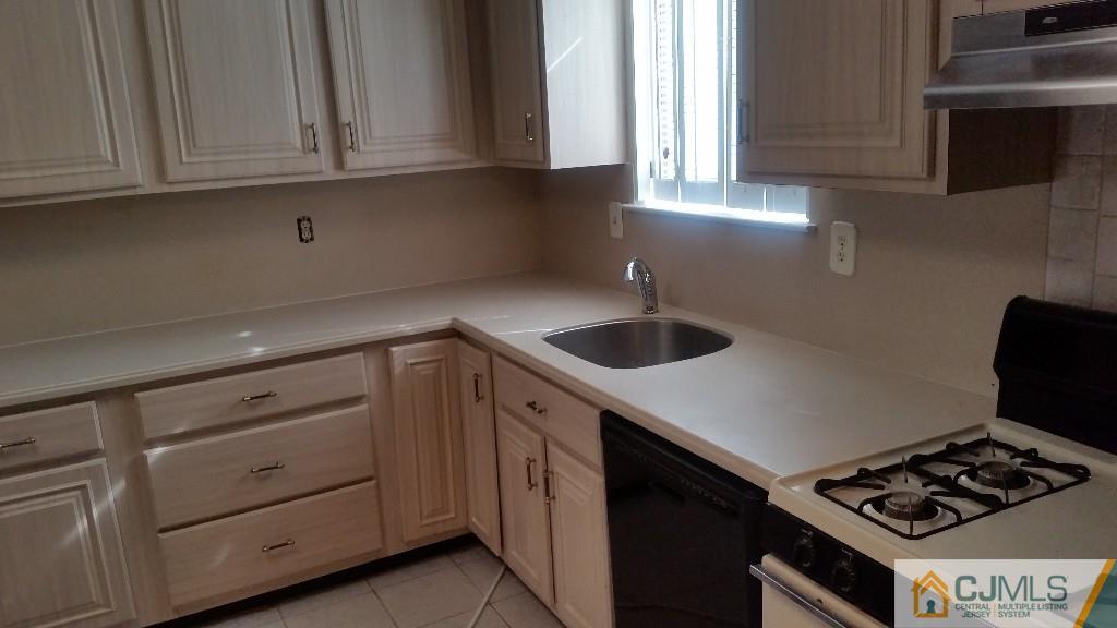 8305 Hana Road Edison, NJ 08817 - Photo 11 of 20 a kitchen with appliances cabinets and a window