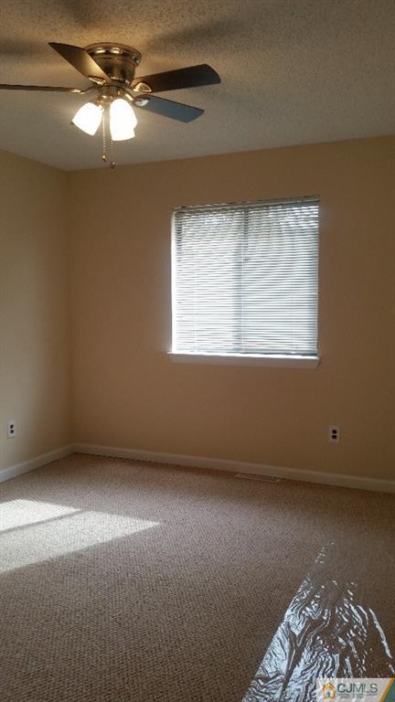8305 Hana Road Edison, NJ 08817 - Photo 15 of 20 a view of an empty room with a window