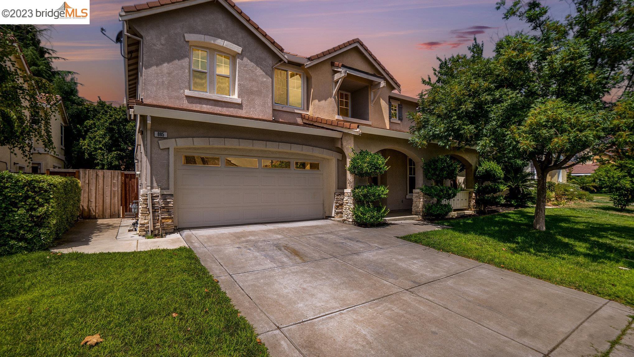885 Inverness Court Brentwood, CA 94513 - Photo 1 of 1 a front view of a house with a yard and garage