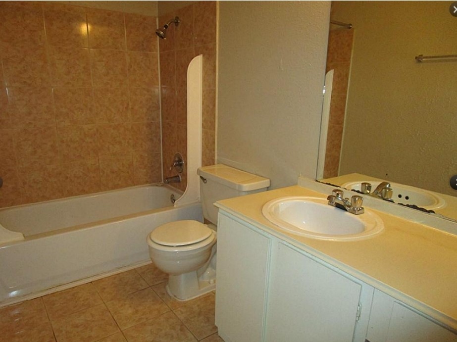 2200 Cypress Landing Road, Unit F3 Houston, TX 77090 - Photo 7 of 7 a bathroom with a sink a toilet and shower