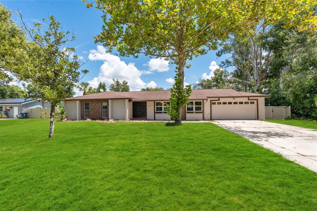 a view of a house with a back yard