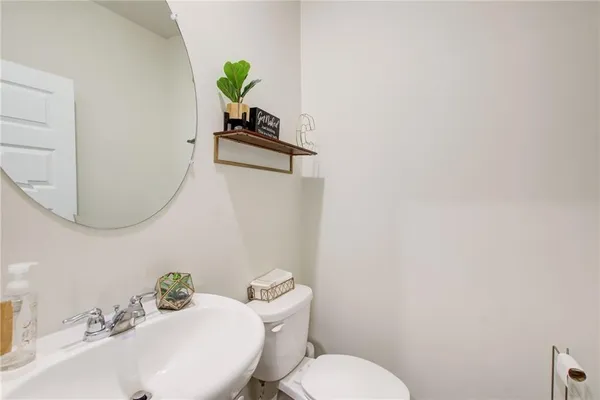 a view of a hallway with two windows