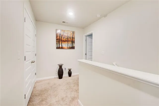 a spacious bedroom with a bed and a couch