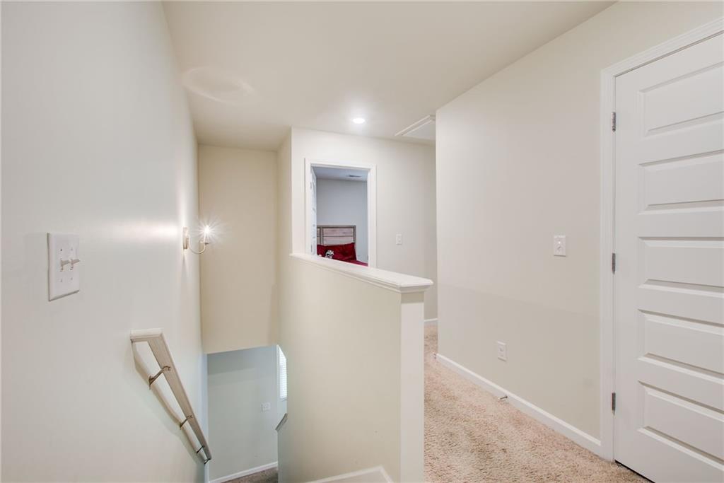 11898 Lovejoy Crossing Boulevard Hampton, GA 30228 - Photo 19 of 30 a very nice looking room with wooden floor