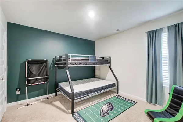 a view of room with stairs and a flat screen tv