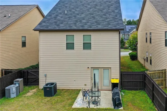 a backyard of a house with seating space
