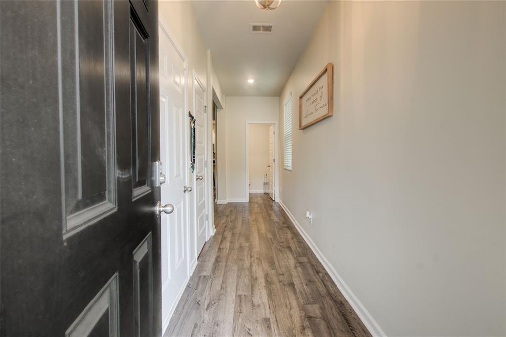 11898 Lovejoy Crossing Boulevard Hampton, GA 30228 - Photo 5 of 30 a view of hallway with wooden floor