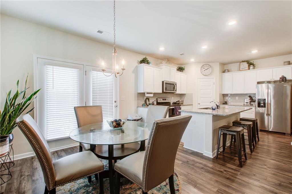 11898 Lovejoy Crossing Boulevard Hampton, GA 30228 - Photo 10 of 30 a view of a dining room with furniture