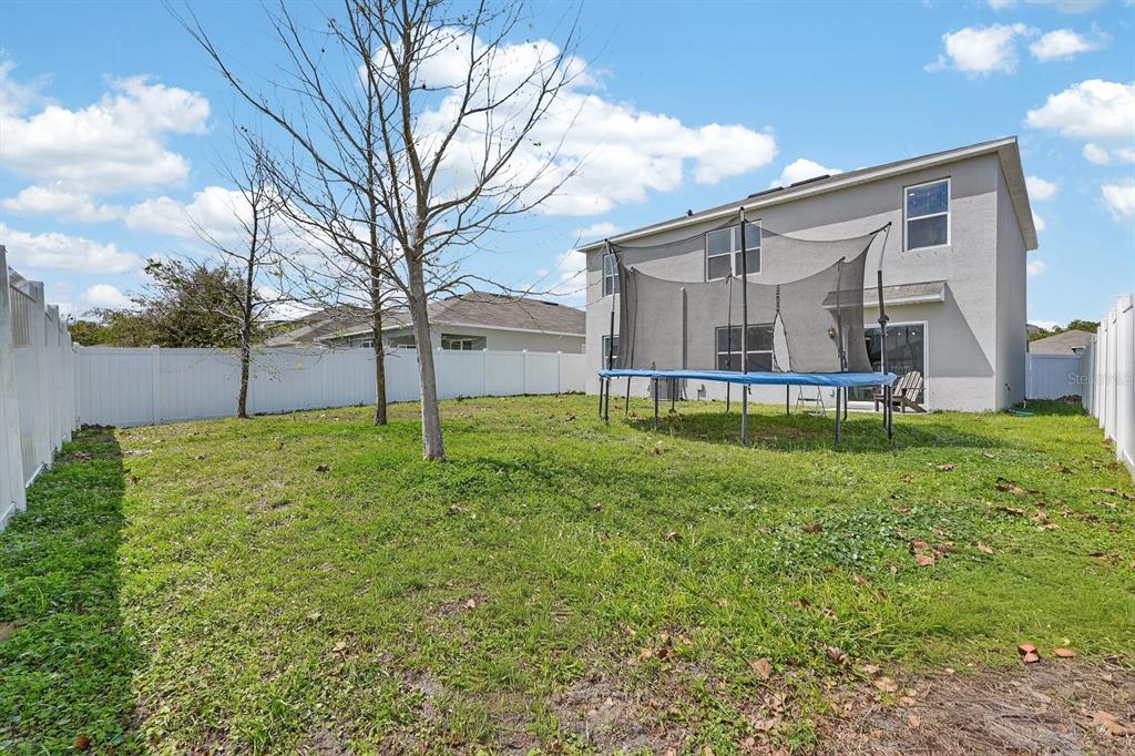 1809 Myrtlebrooke Drive Edgewater, FL 32141 - Photo 38 of 58 a view of a backyard with a garden