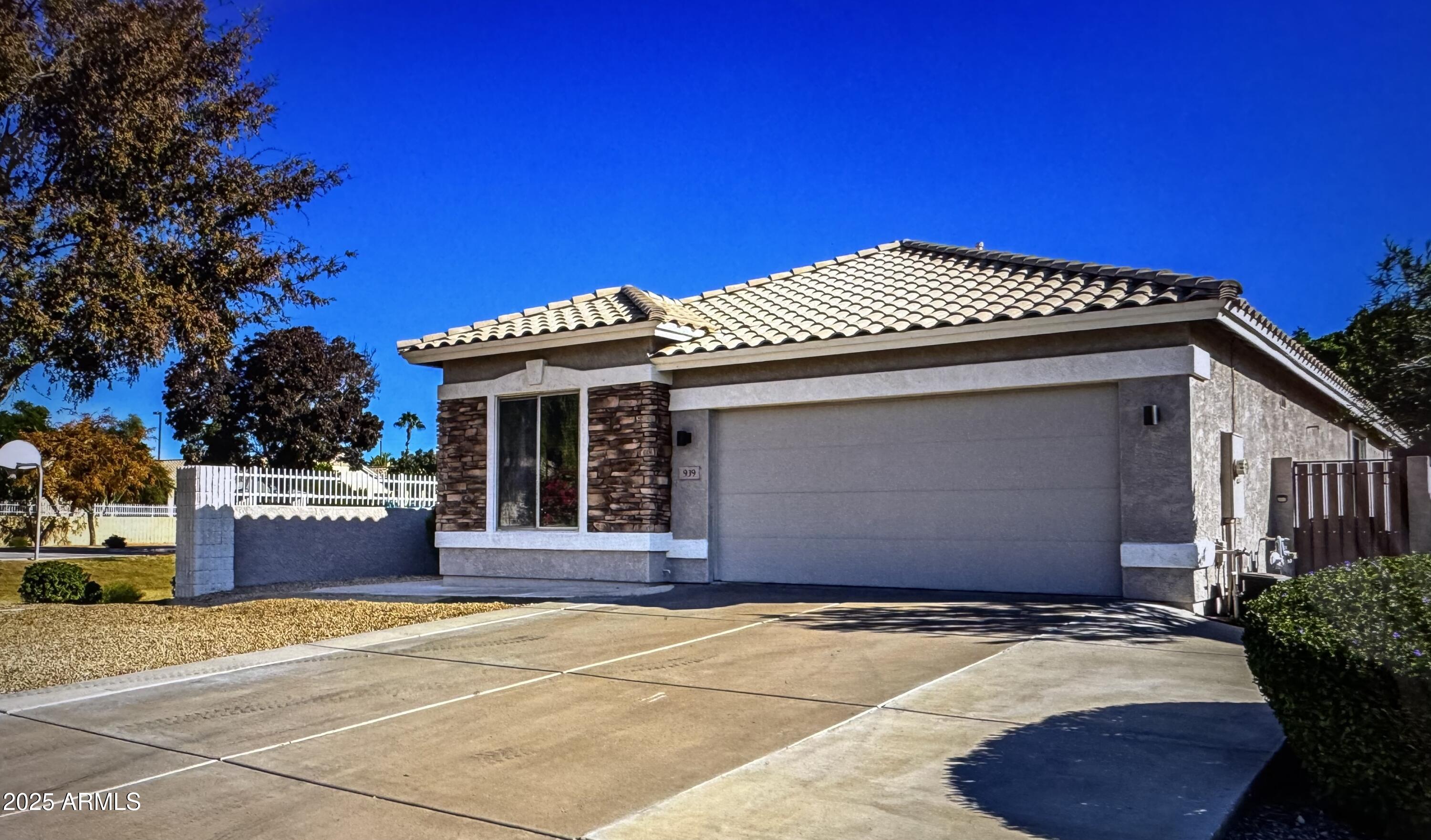 a front view of a house with a garage