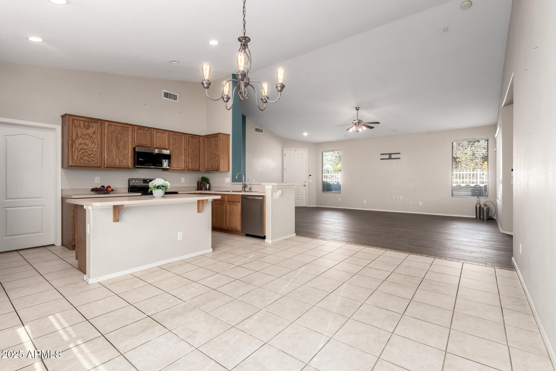 939 South Roca Street Gilbert, AZ 85296 - Photo 17 of 40 a view of kitchen with granite countertop cabinets a sink and a counter top space