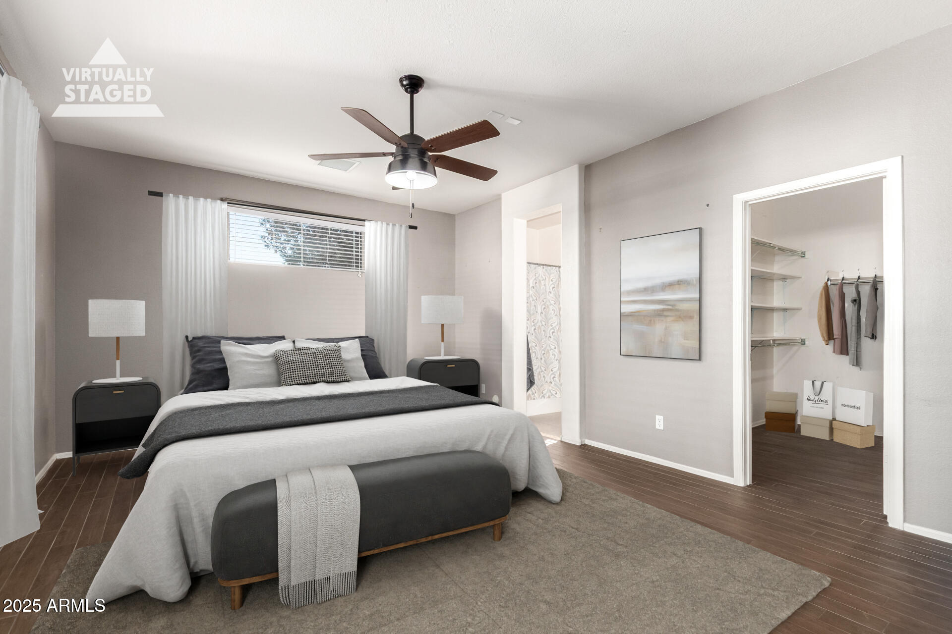 939 South Roca Street Gilbert, AZ 85296 - Photo 18 of 40 a bedroom with a bed and a walk in closet