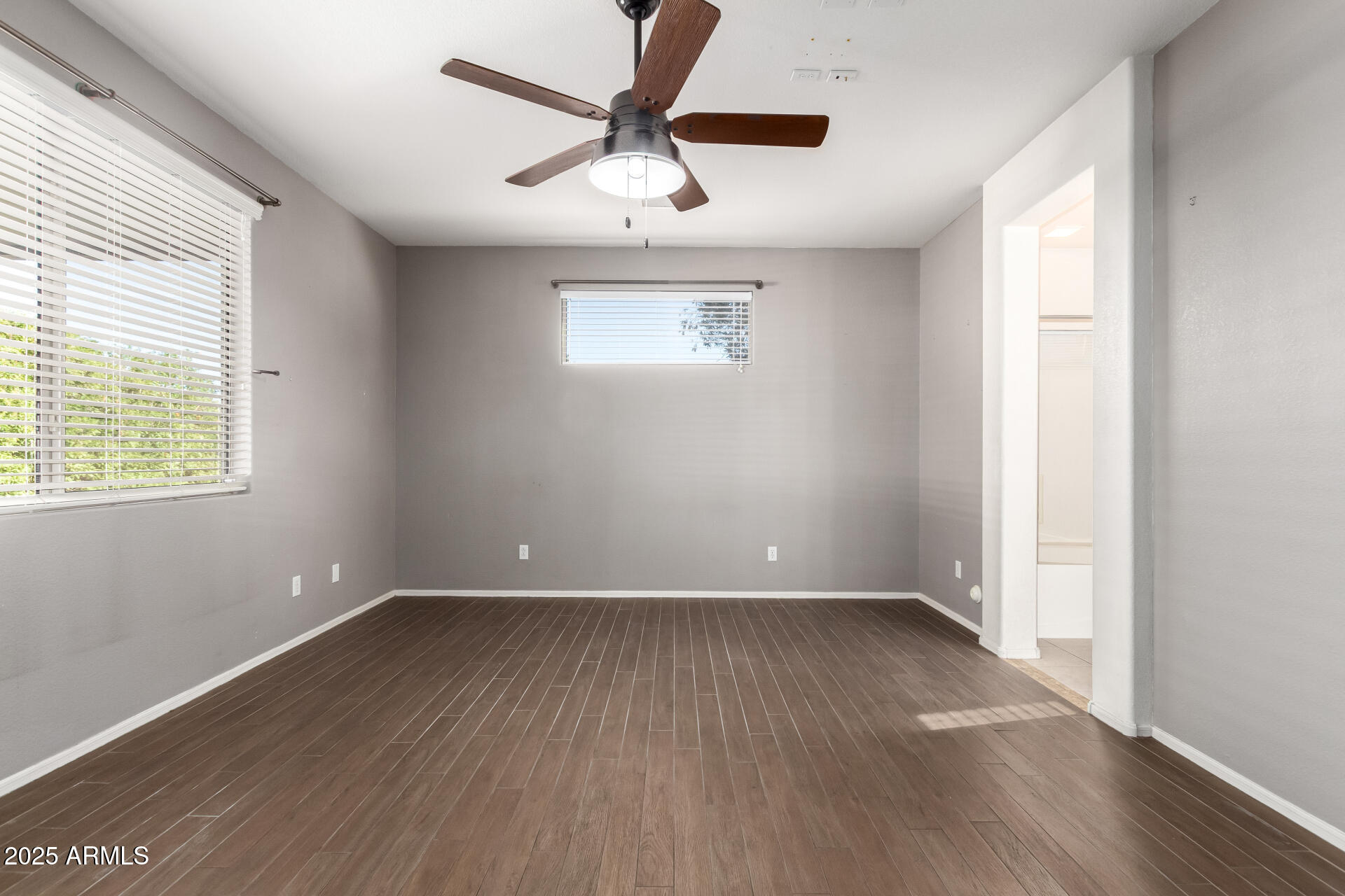 939 South Roca Street Gilbert, AZ 85296 - Photo 20 of 40 an empty room with wooden floor and windows