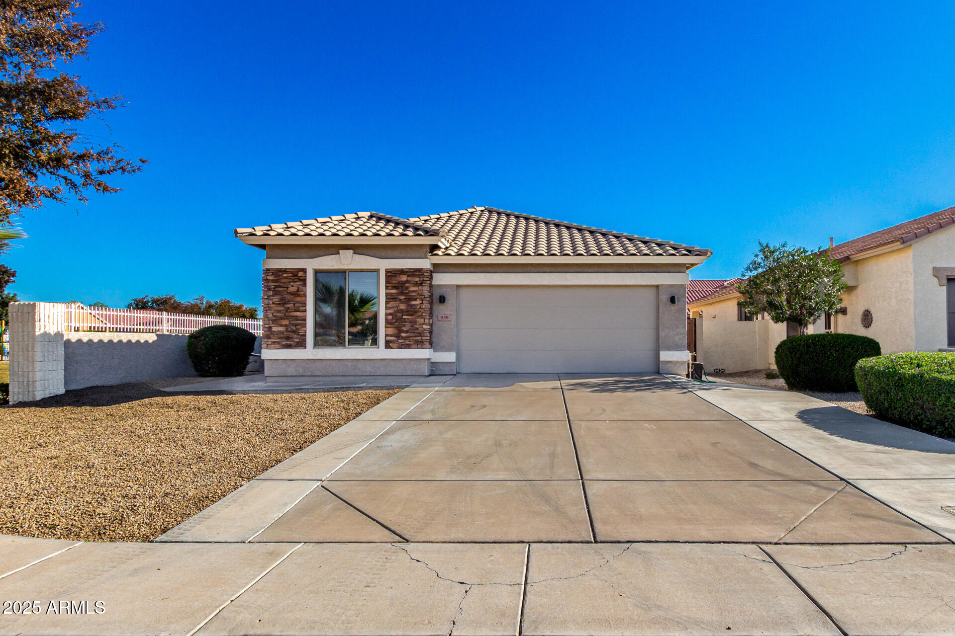 939 South Roca Street Gilbert, AZ 85296 - Photo 2 of 40 a view of a house with a patio